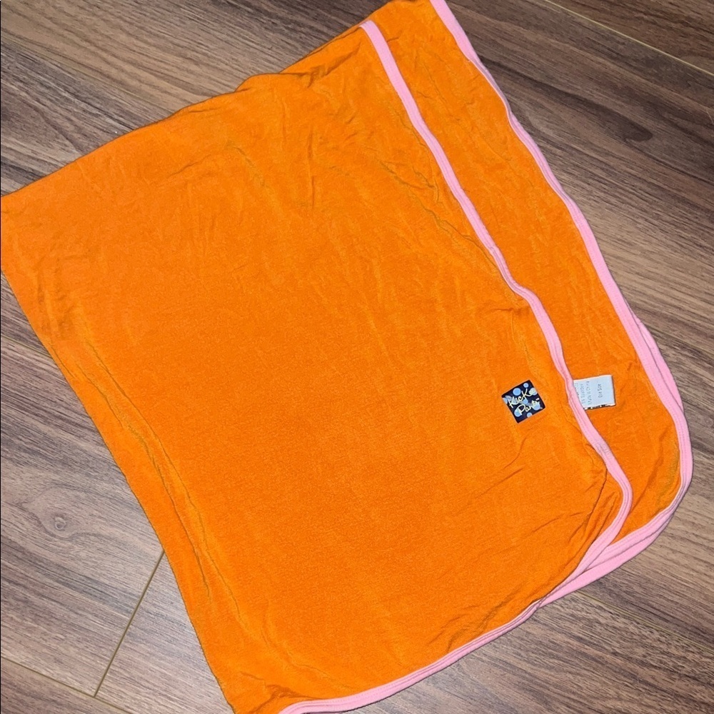 Orange kickee pants swaddle/blanket